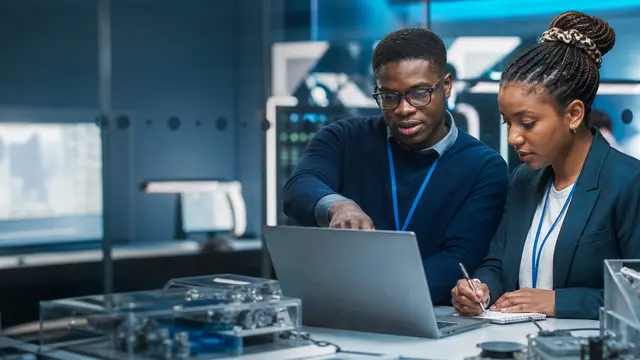Young South African technology professionals solving a problem together